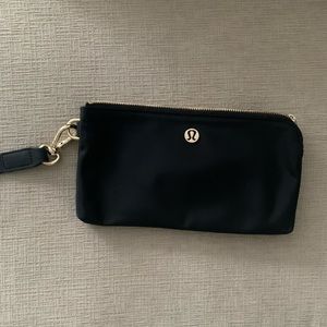 Brand new Lululemon black and gold wristlet
